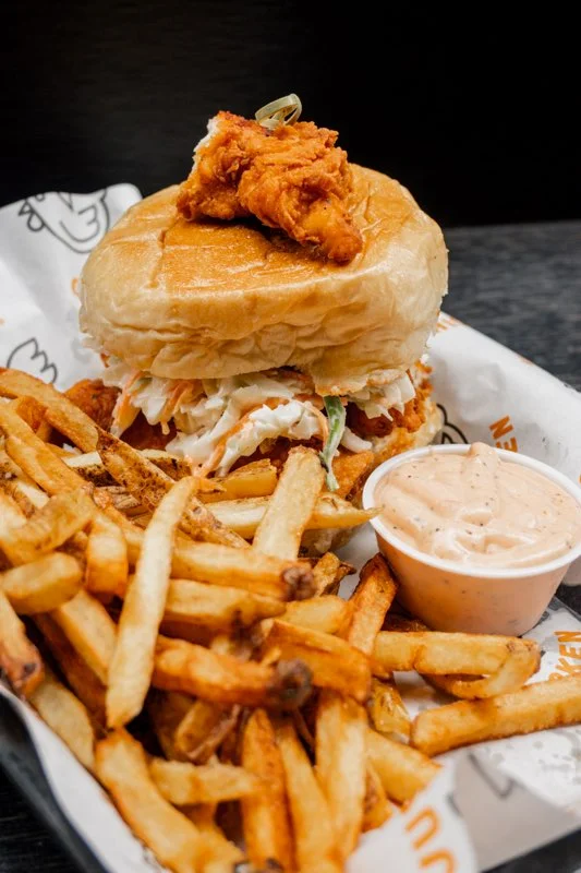 Crispy fried chicken sandwich with fries