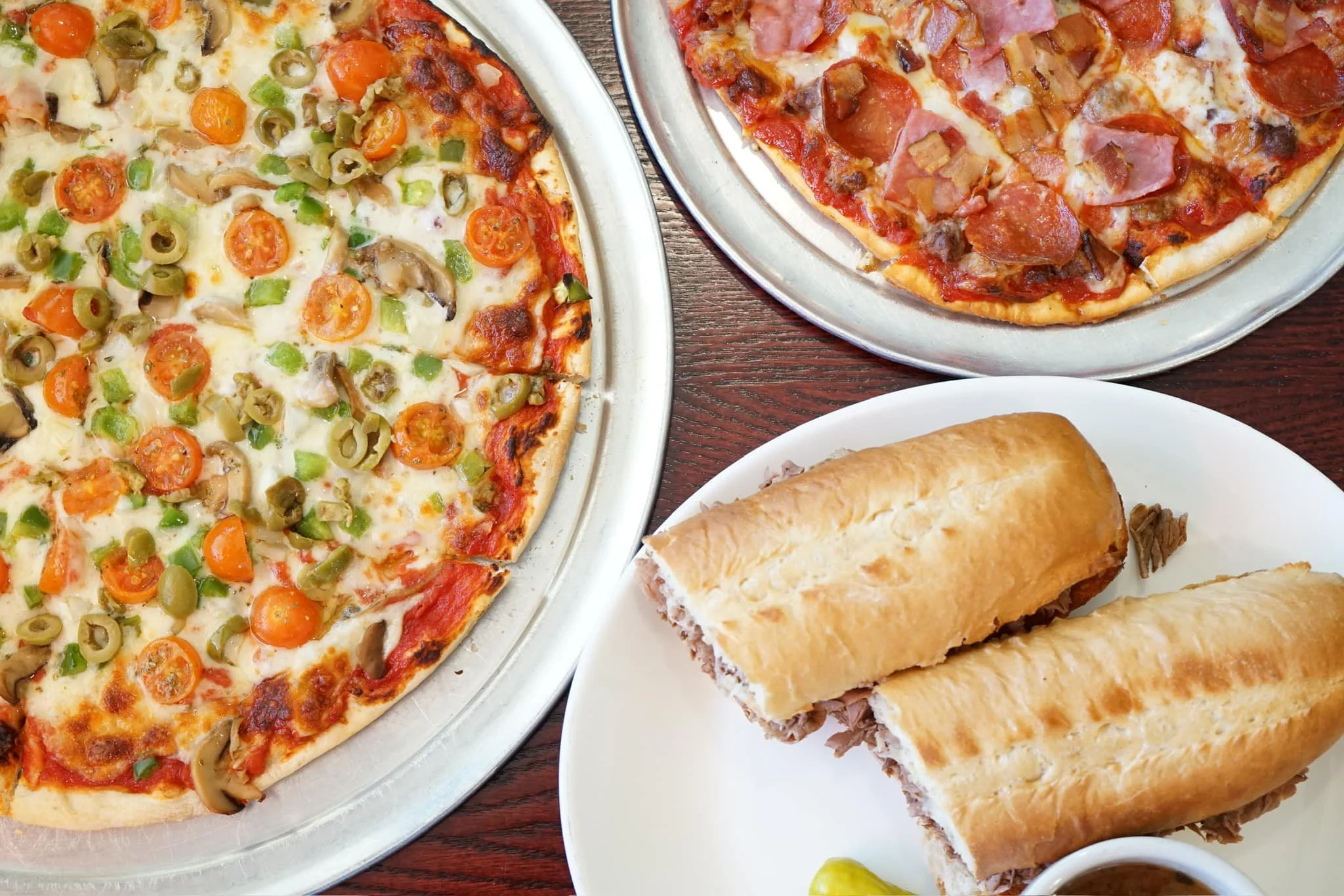 Delicious pepperoni pizza and Italian beef sandwiches