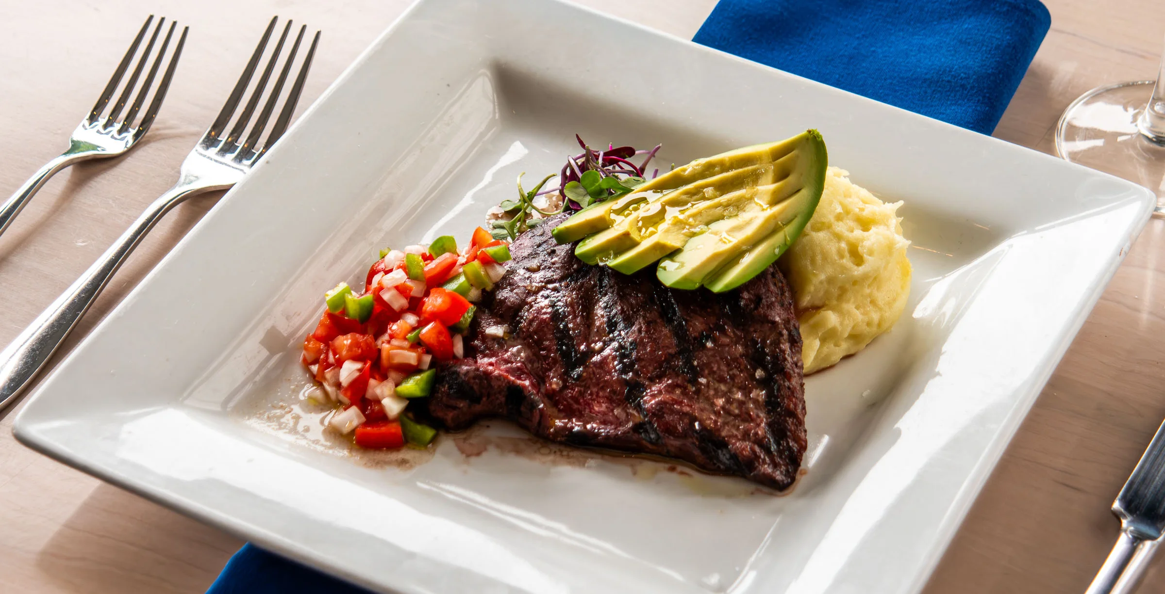 Sliced steak with seasonal vegetables and berry sauce
