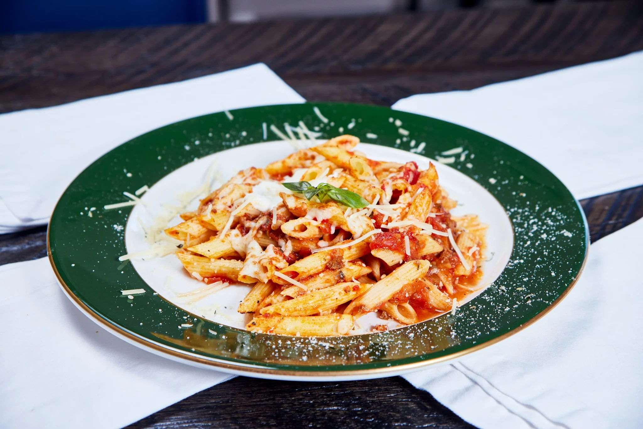 Penne arrabbiata pasta with cheese and basil
