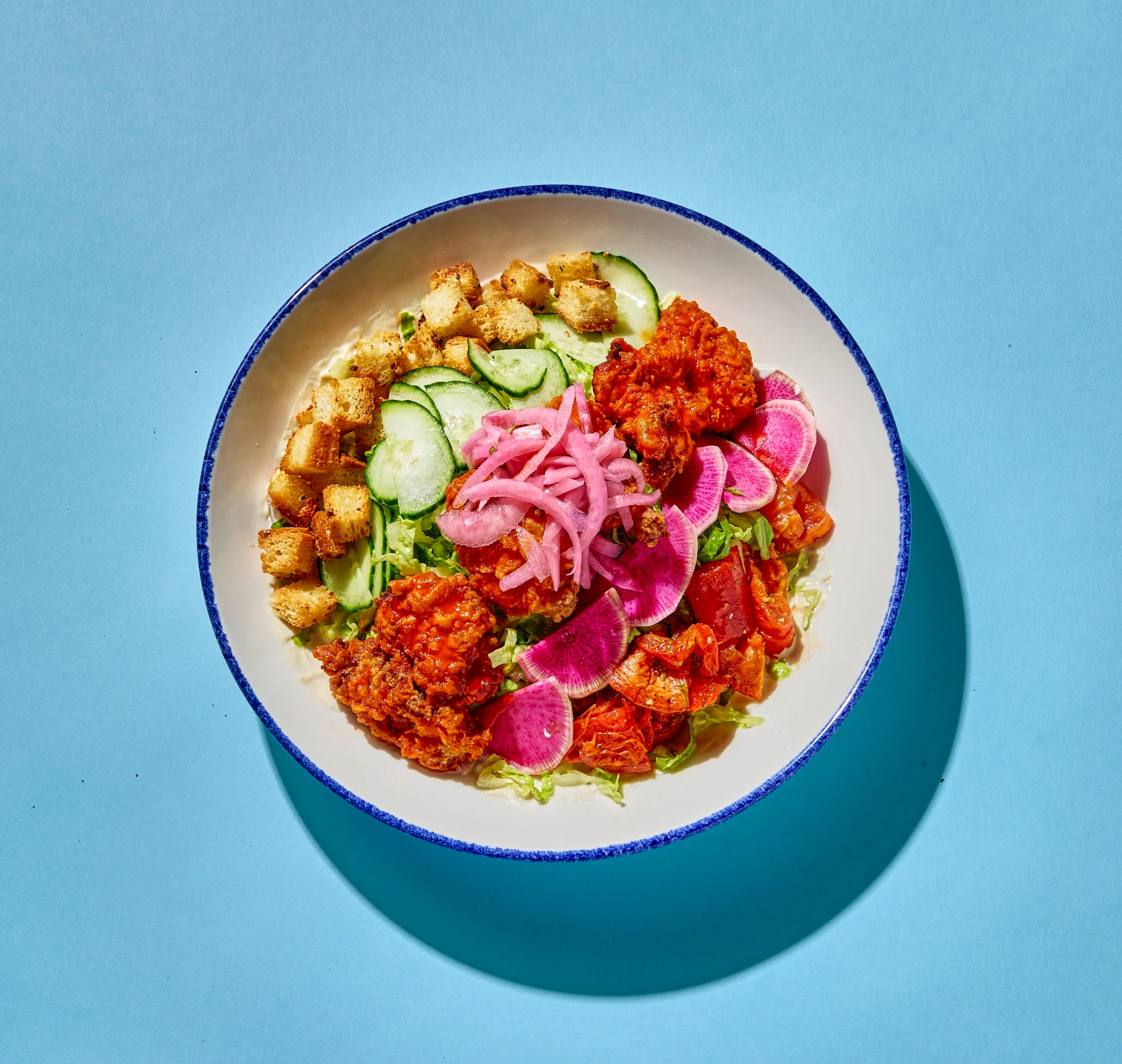Vibrant Southern-style fried chicken salad with fresh vegetables