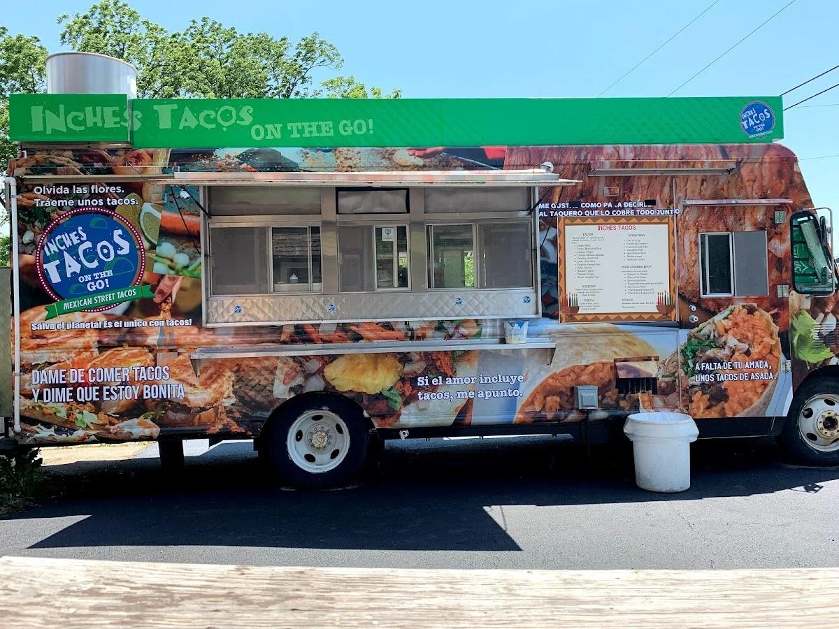 Colorful food truck serving Mexican street tacos