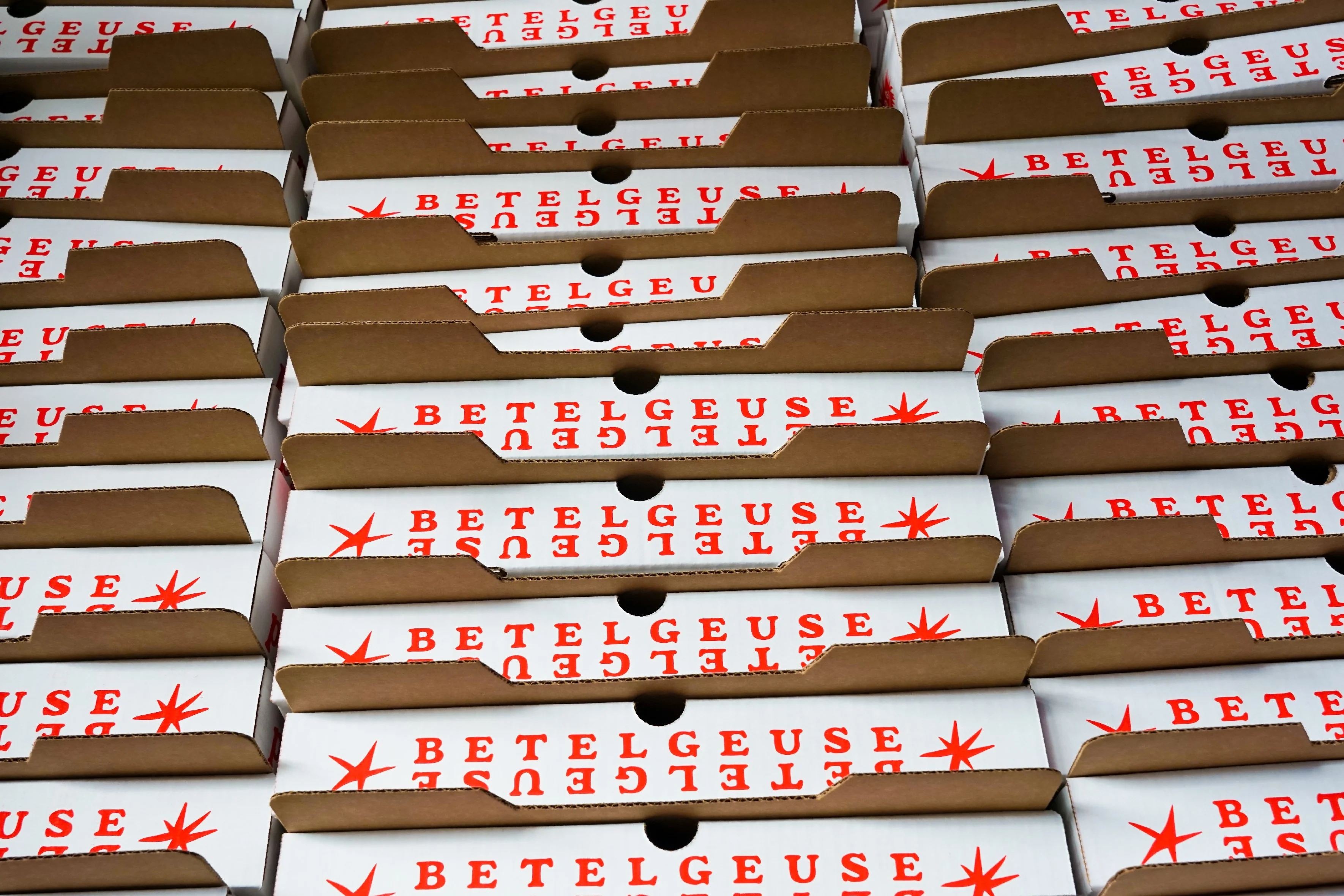 Stacked pizza boxes at Betelgeuse Betelgeuse