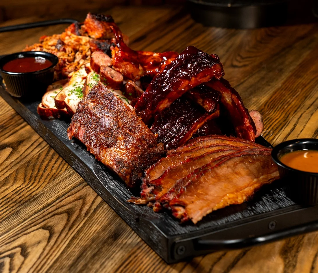 Assorted barbecue platter featuring ribs and brisket