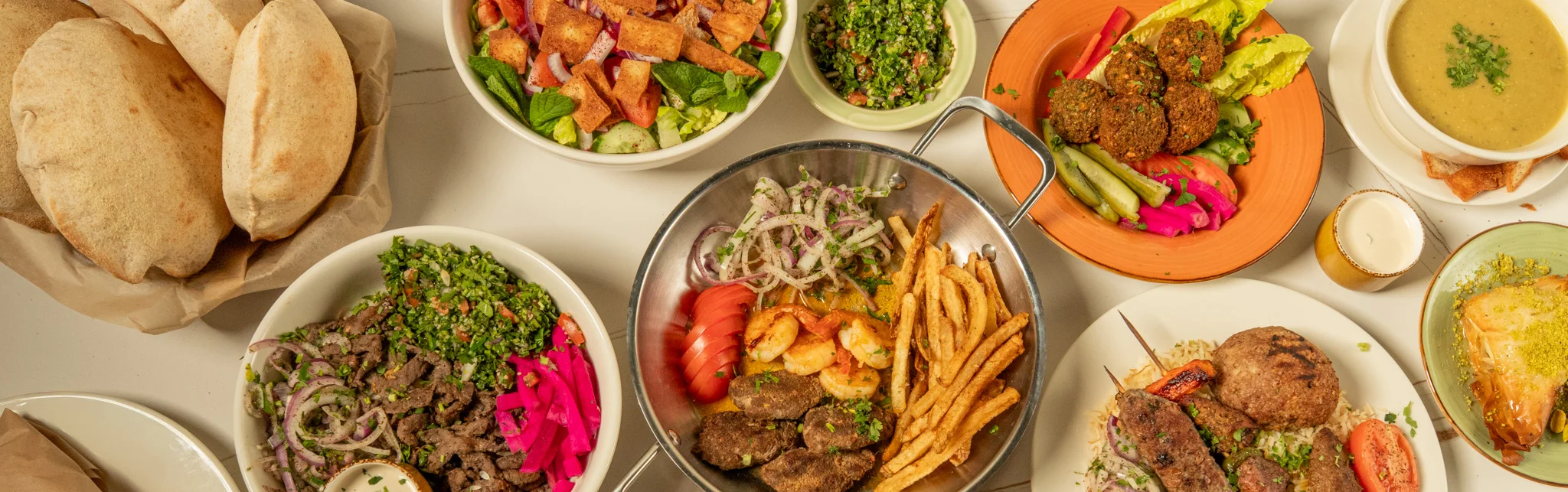 A vibrant Mediterranean restaurant interior with colorful decor and seating.
