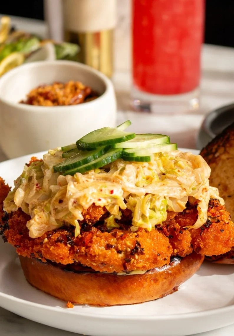 Southern-style fried chicken sandwich with slaw and pickles