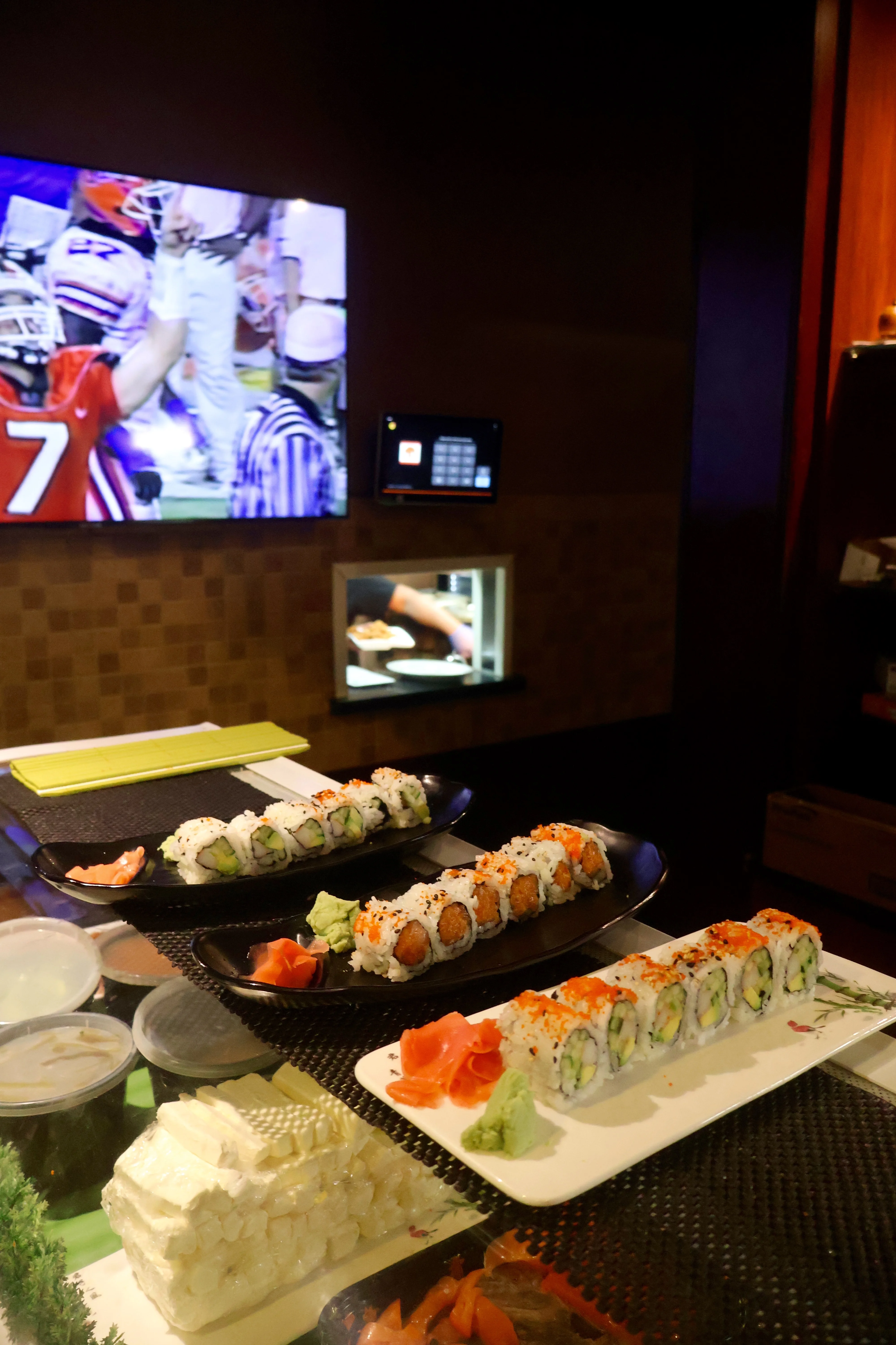 Assorted sushi rolls served in a modern restaurant setting