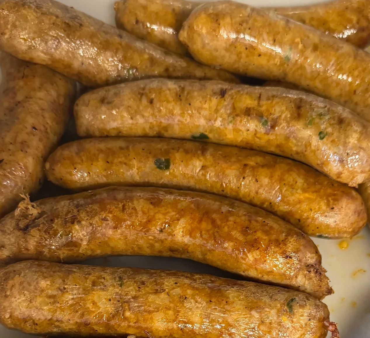 Grilled German bratwurst sausages on a platter