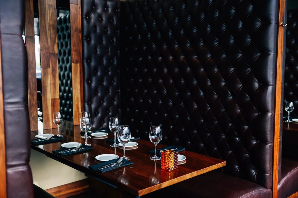 Elegant restaurant booth with plush leather seating