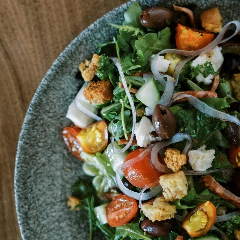 Mediterranean salad with olives and fresh vegetables