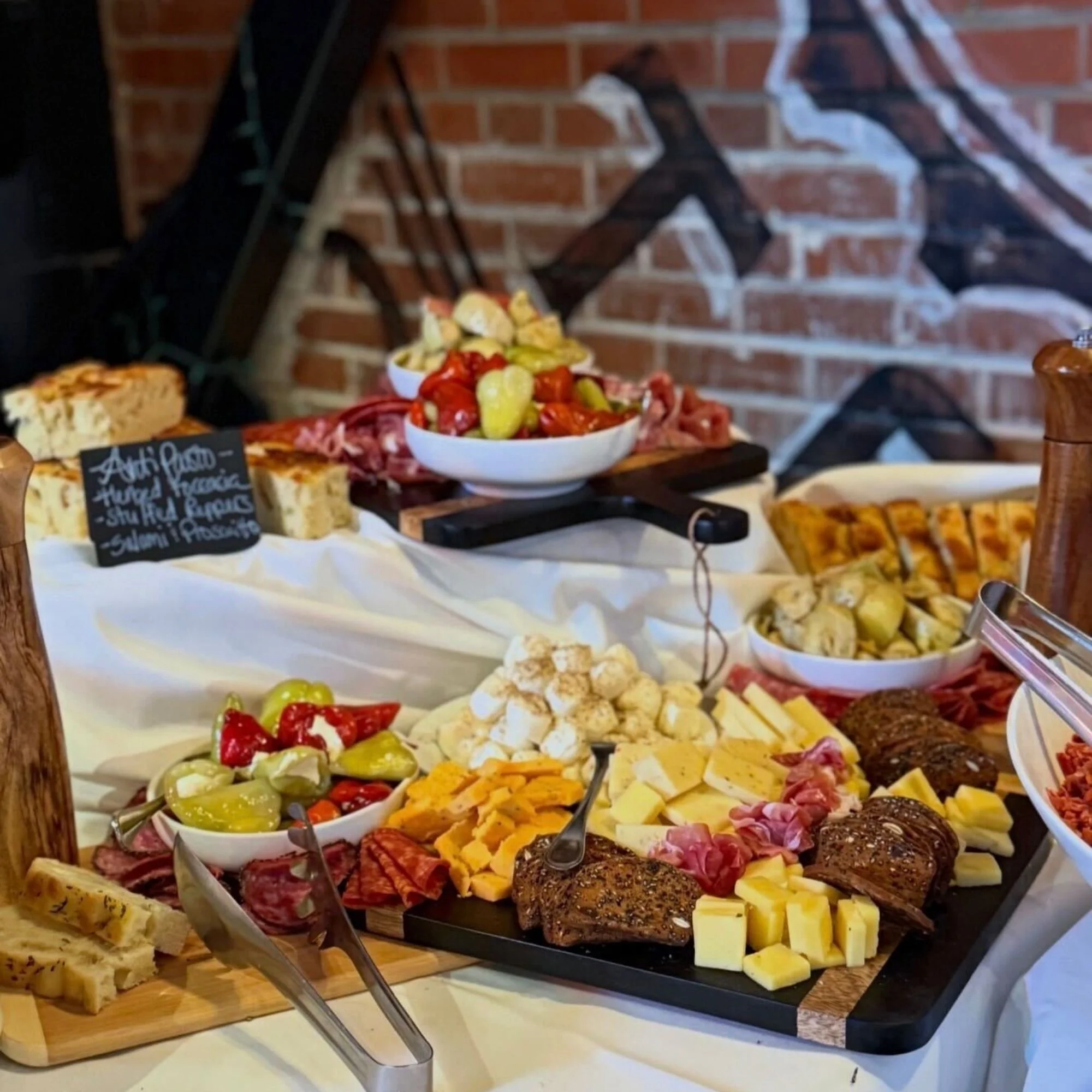 Charcuterie board with cured meats, cheese, and fresh fruit at Bass Street in Moline, IL
