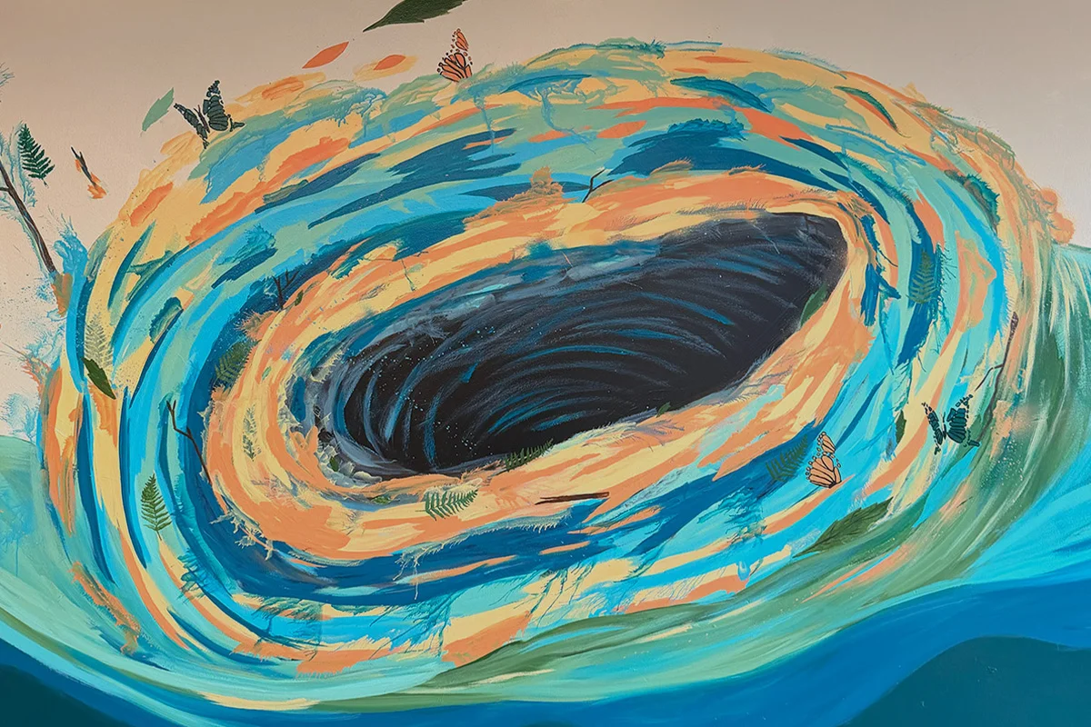 Vibrant mural depicting a swirling vortex of colors and nature elements