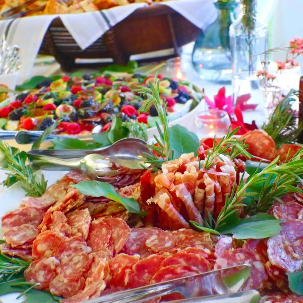 Italian charcuterie board with assorted meats and garnishes