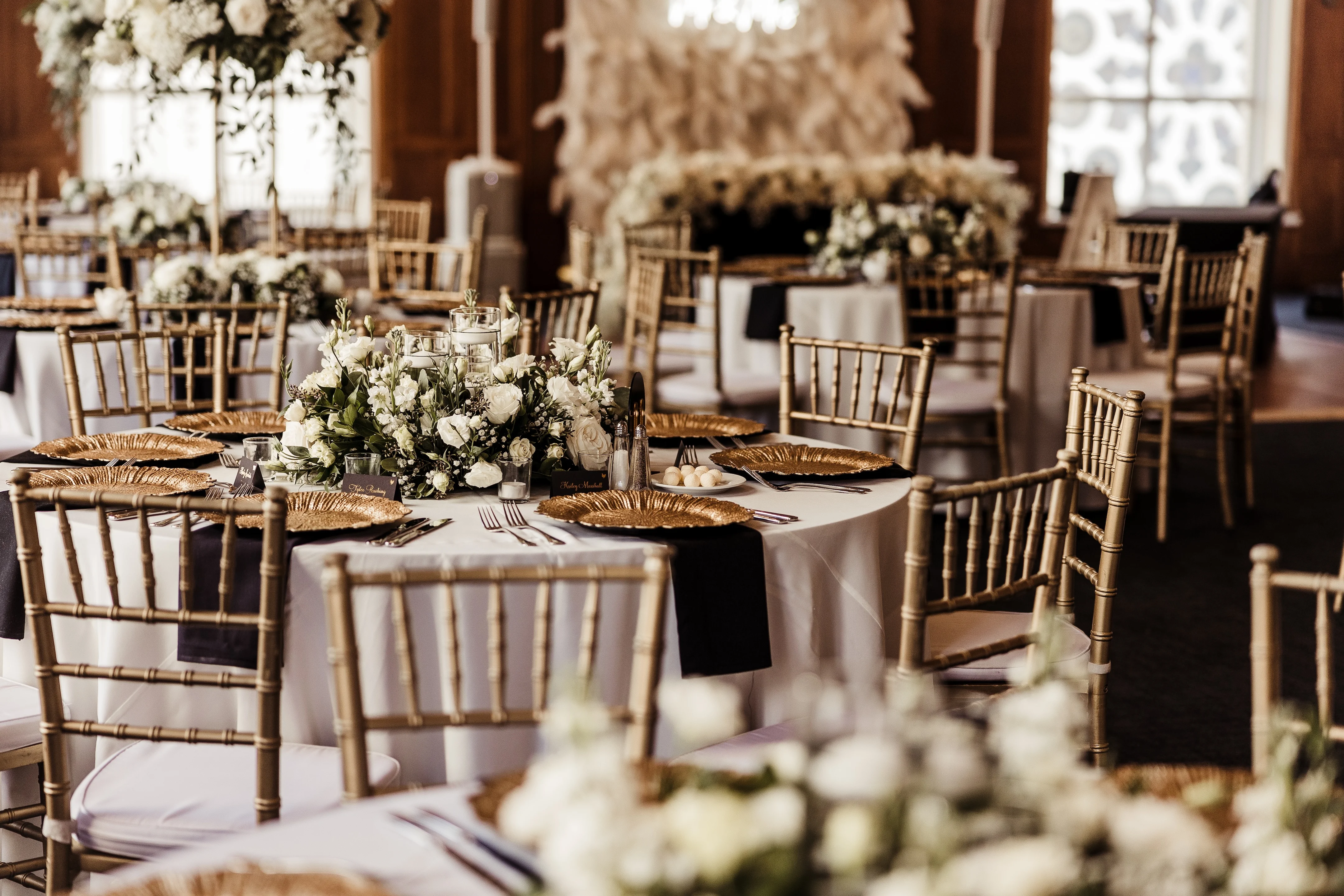 Elegant dining setup with floral centerpieces and gold accents