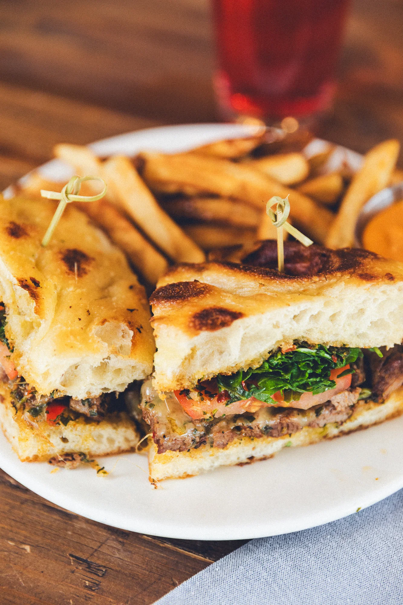Savory Mediterranean sandwich with fries on a plate