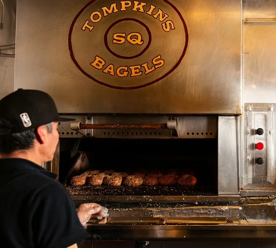 Delicious gourmet burger with fresh toppings on a wooden table
