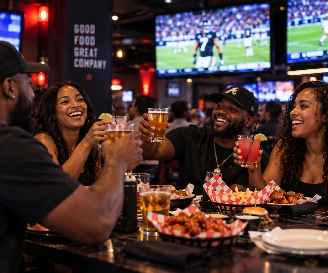 Friends toasting with drinks in a lively restaurant atmosphere
