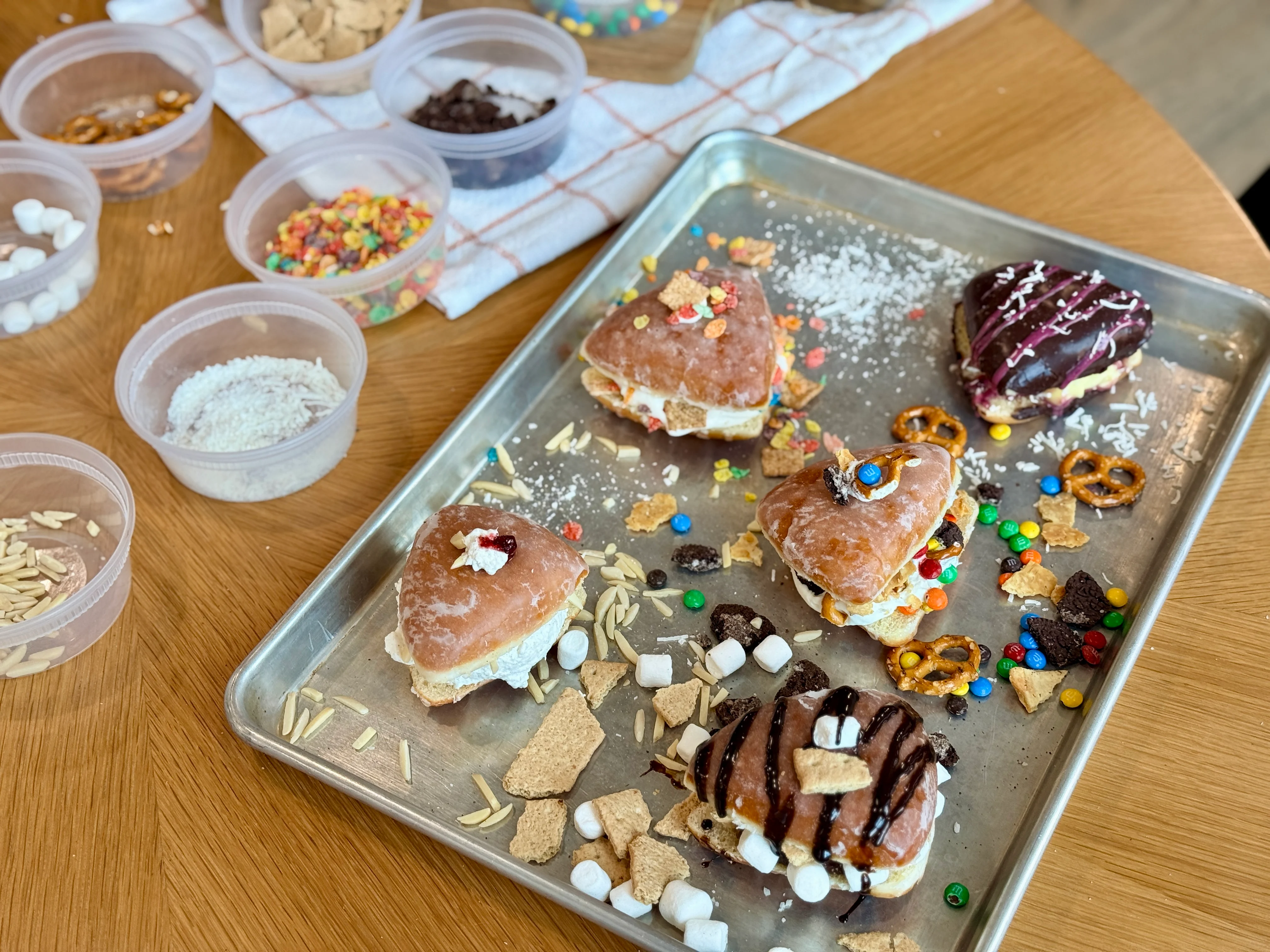 Colorful gourmet donuts with various toppings and fillings