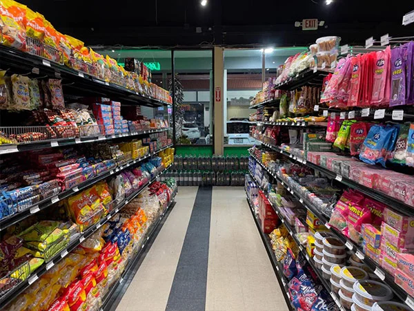 Aisle of colorful snacks and candies in a grocery store