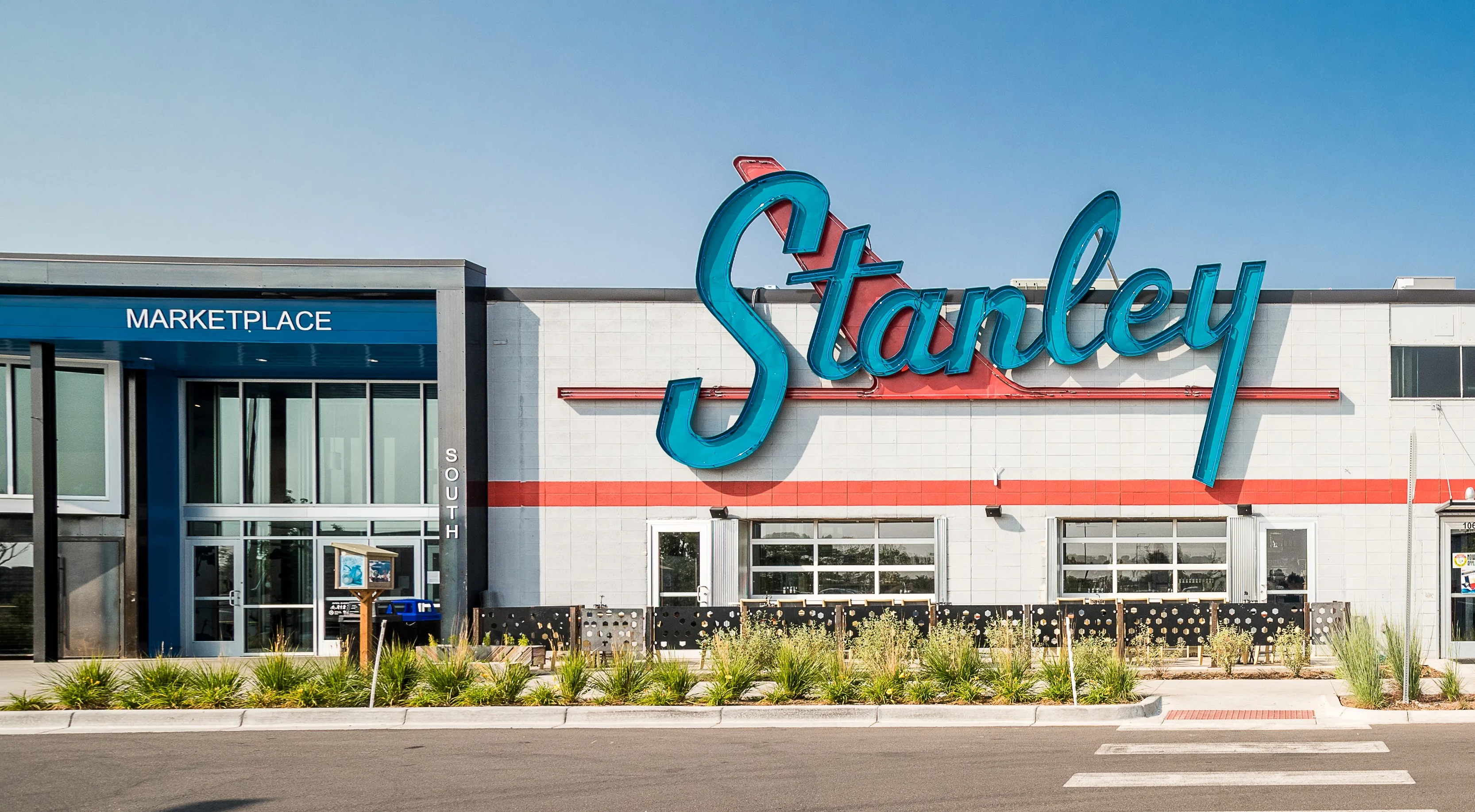 Exterior view of Stanley restaurant with vibrant signage
