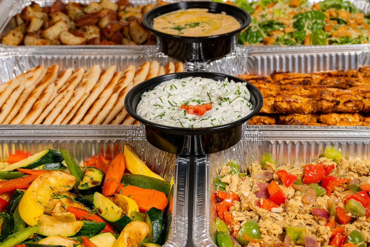 Mediterranean feast with grilled chicken and assorted sides
