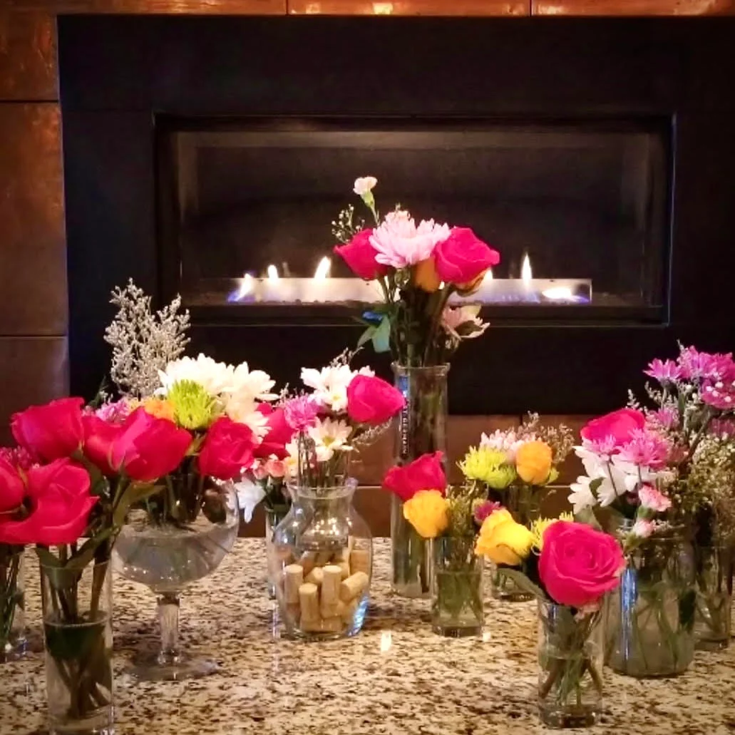 A vibrant restaurant event setup with tables and decorations.