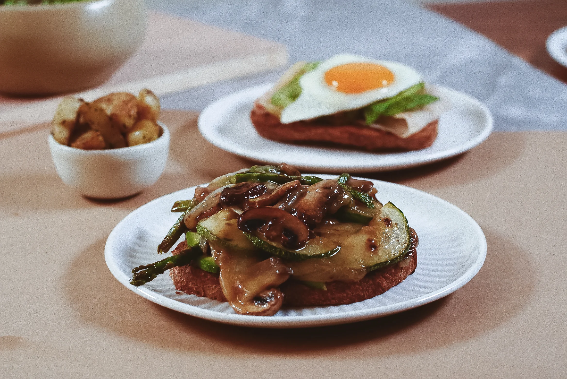 Open-faced vegetable sandwich with sautéed mushrooms and asparagus