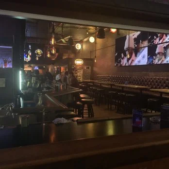 Couple enjoying a night out at a lively bar
