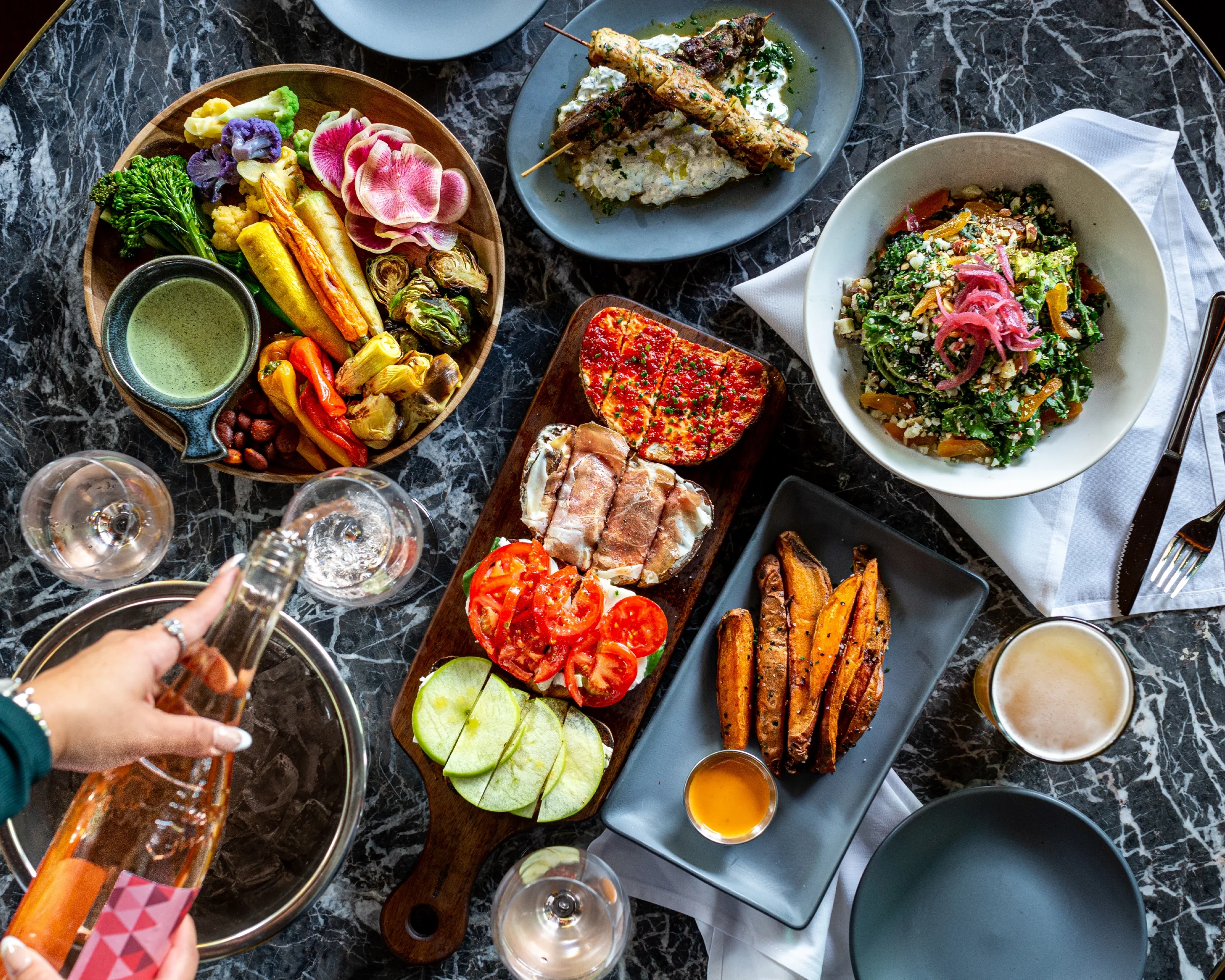 Colorful Mediterranean mezze platter with fresh vegetables and dips