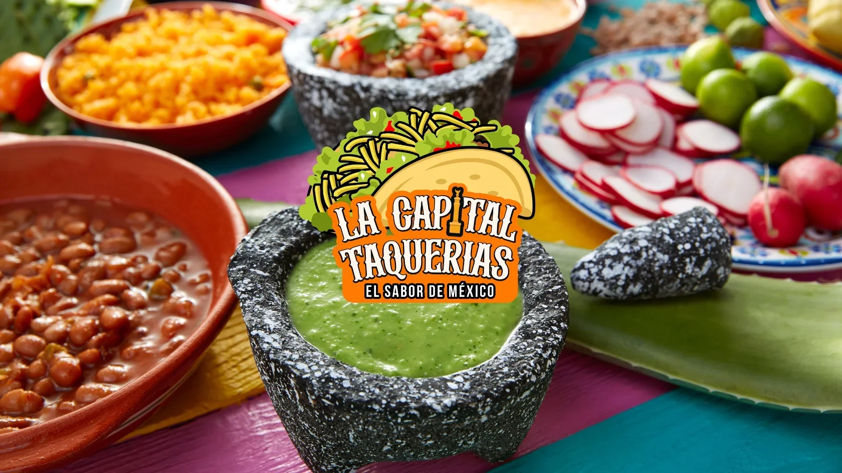 Colorful Mexican taqueria spread with salsa and beans