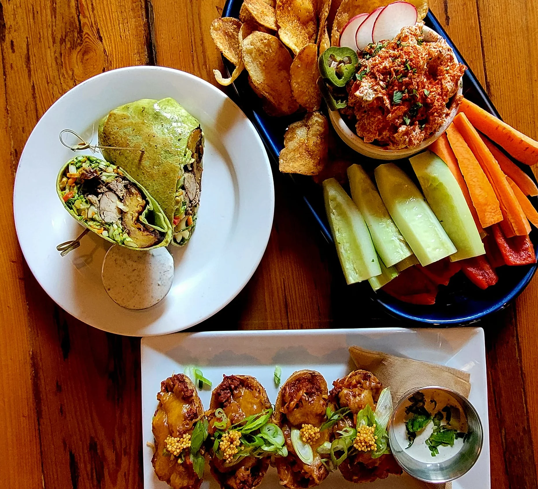 Colorful wrap and appetizers in a vibrant restaurant setting