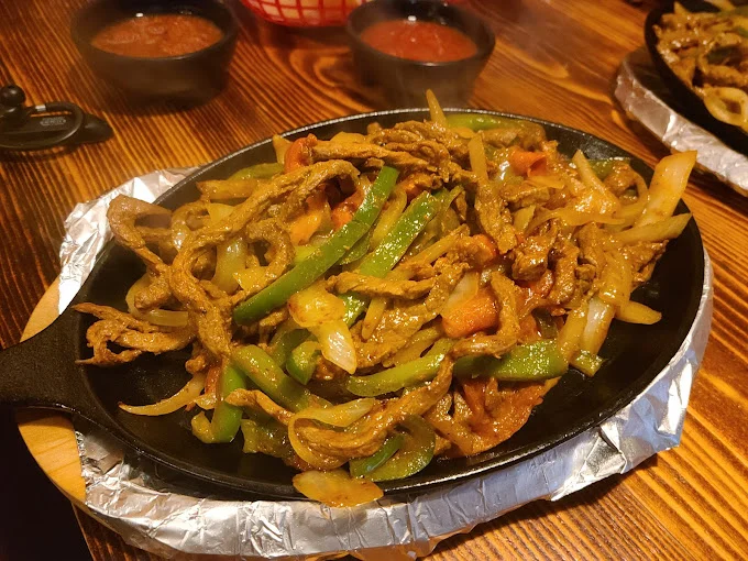 A restaurant chef preparing a dish