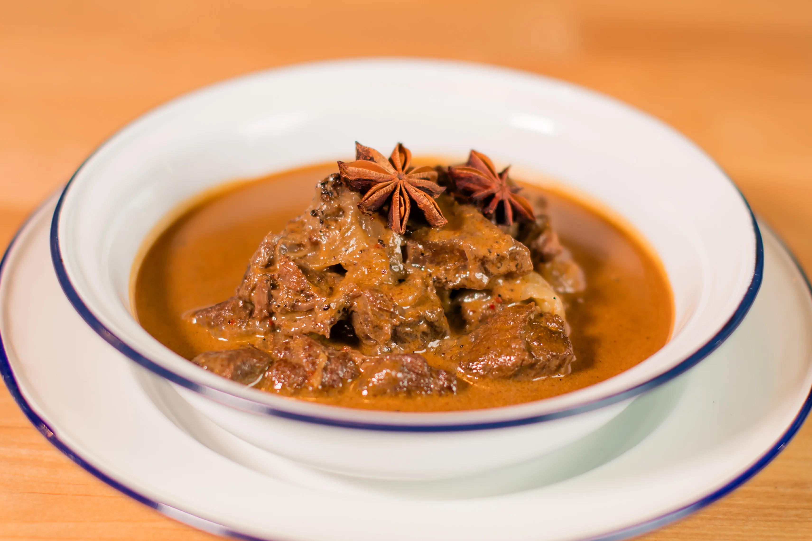 Rich Indian beef curry with star anise garnish
