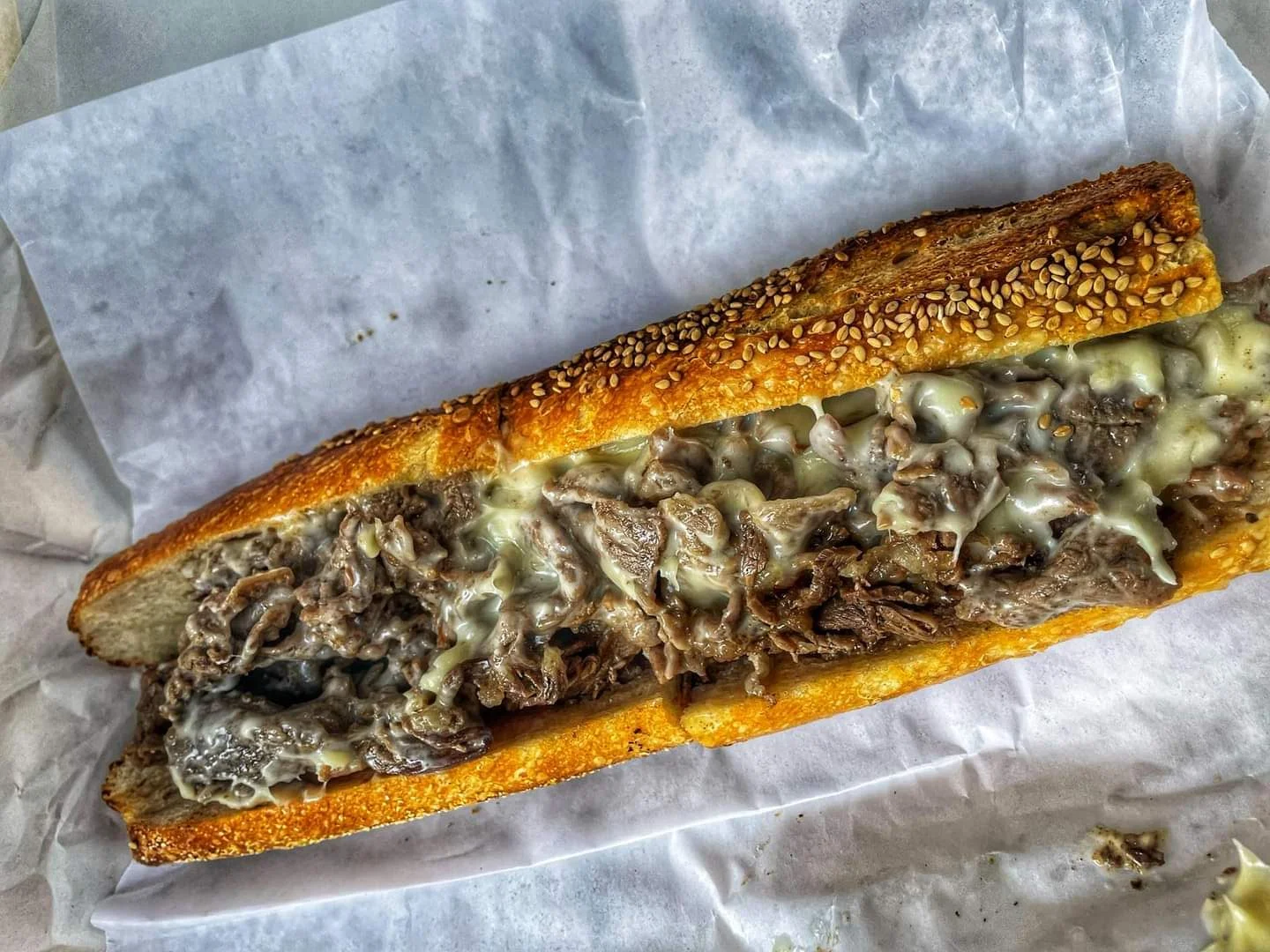 Classic Philly cheesesteak sandwich with melted cheese