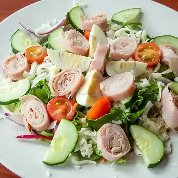 Fresh salad with cucumbers and tomatoes at Marco's Italian Restaurant in Ashland VA