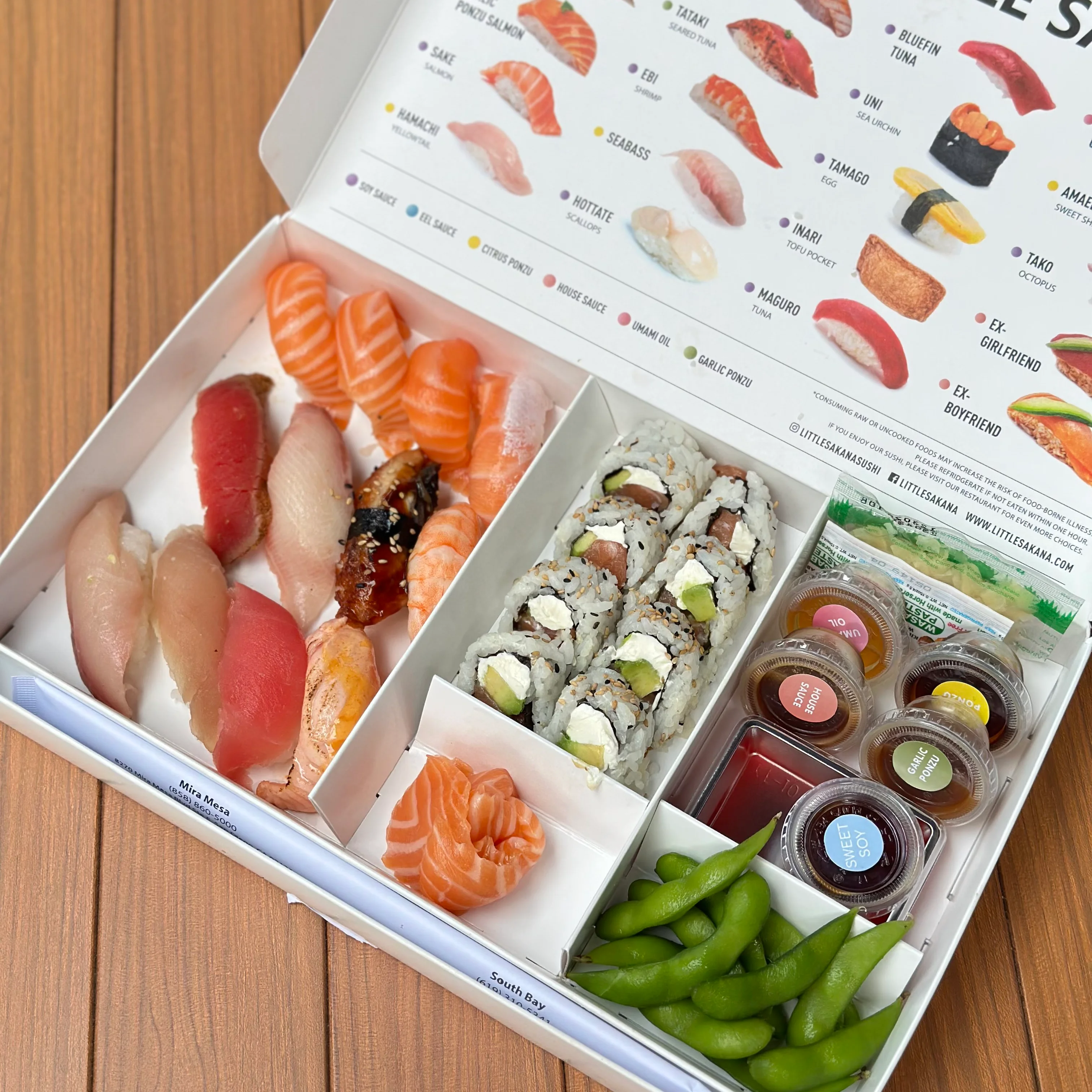 Assorted sushi platter featuring nigiri and rolls