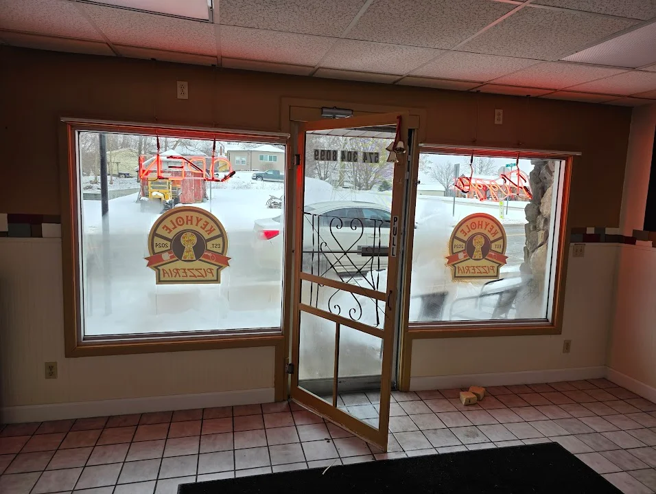 Cozy restaurant entrance with snow outside