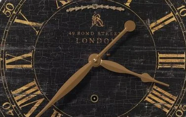 Vintage wall clock with Roman numerals and distressed finish