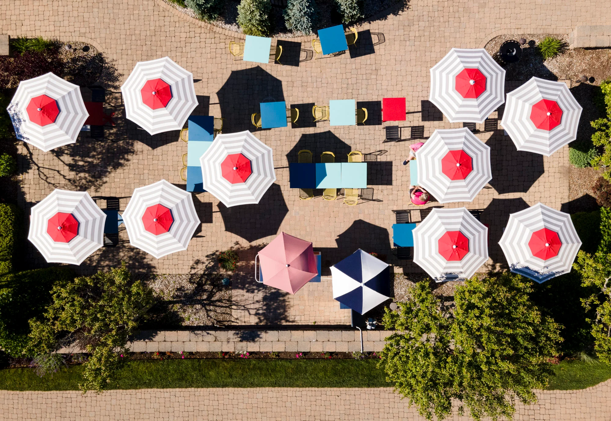 Outdoor dining area with colorful umbrellas and seating