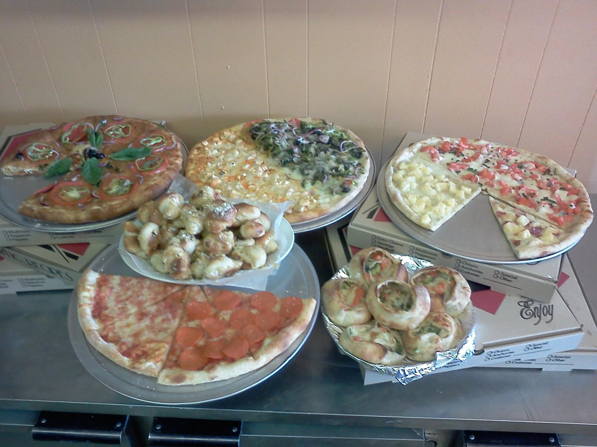 Variety of pizzas including Margherita and pepperoni