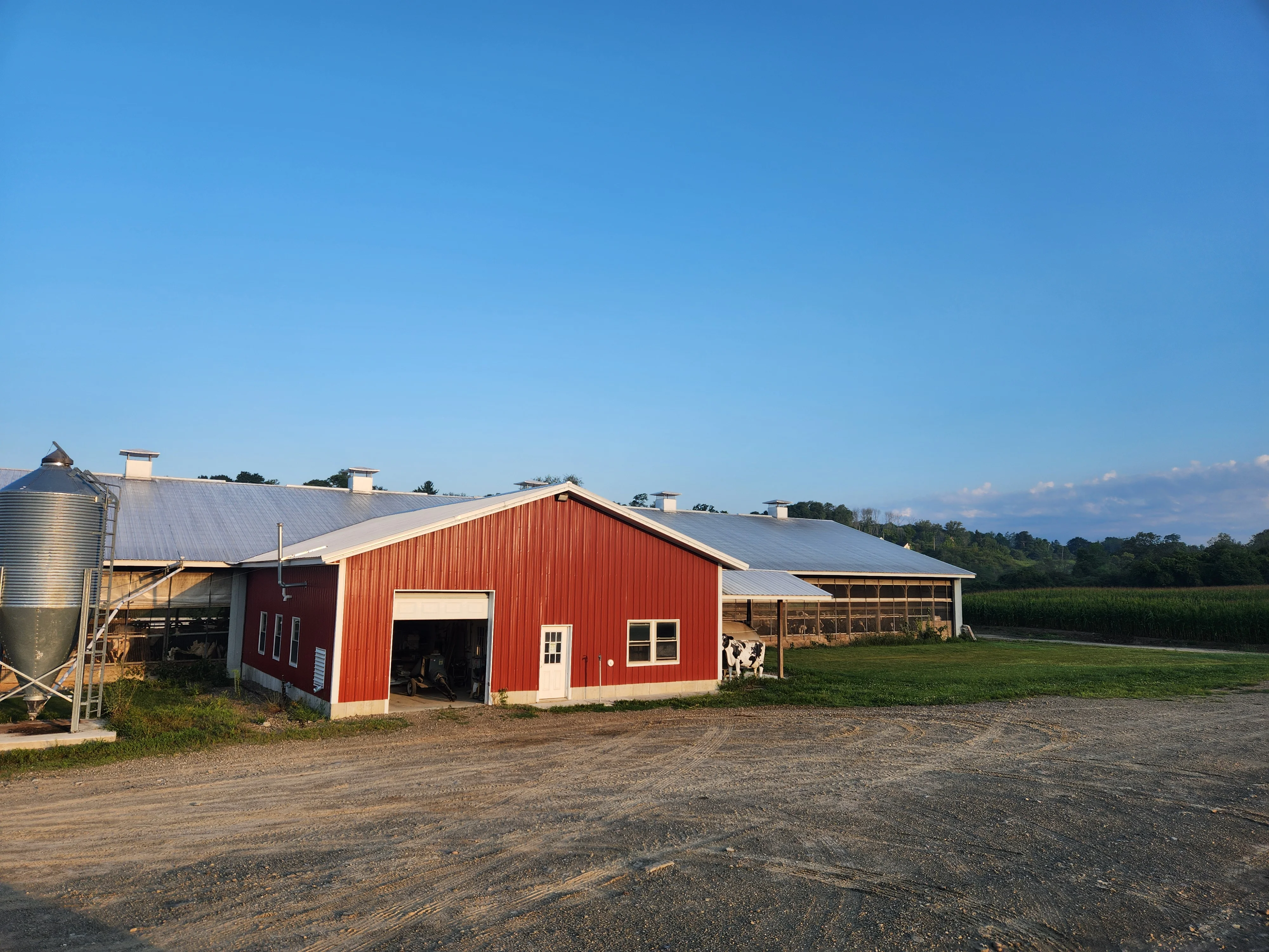 Red barn on a farm with clear blue sky