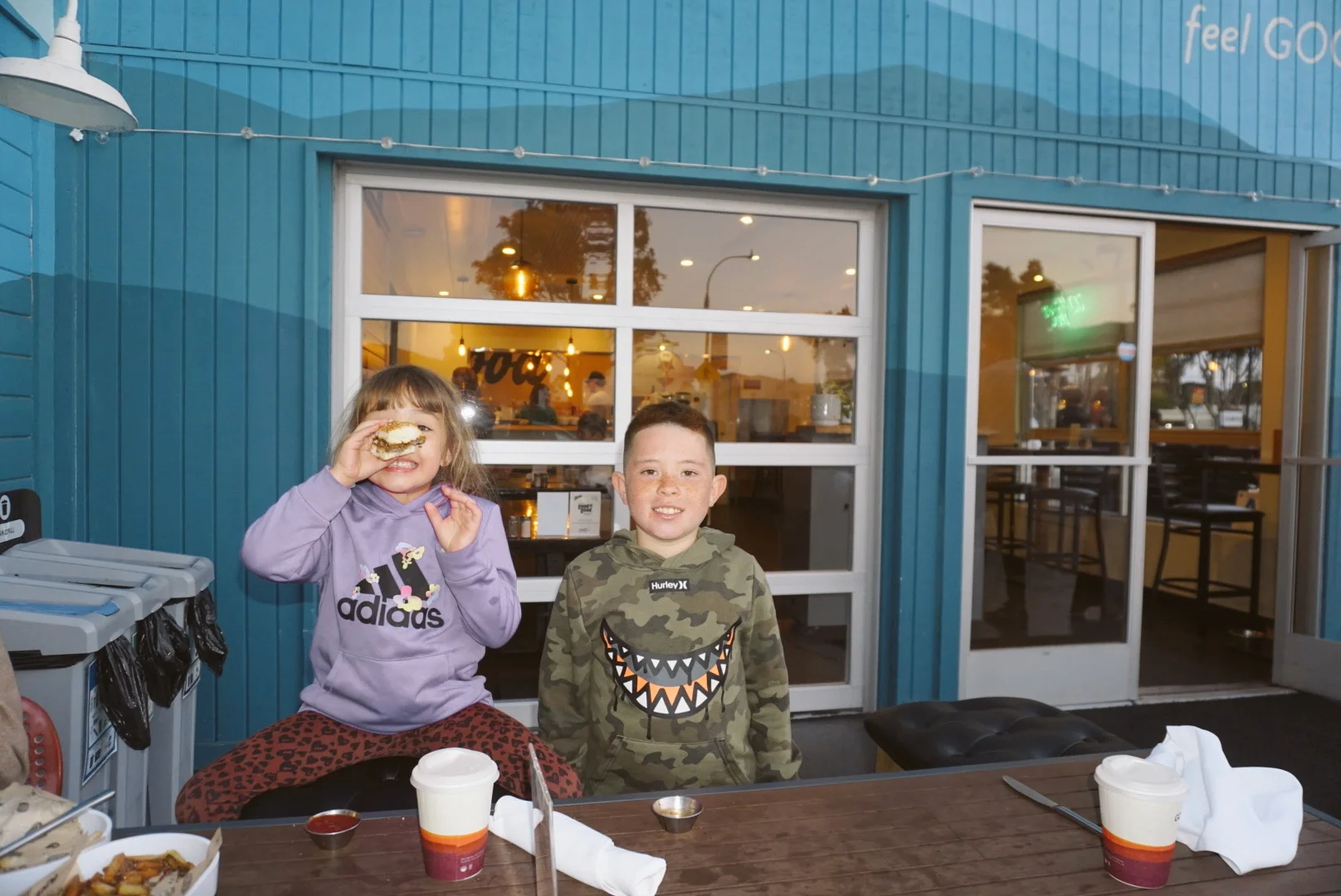Children enjoying food at a casual restaurant