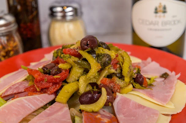 Italian antipasto platter with cured meats and olives