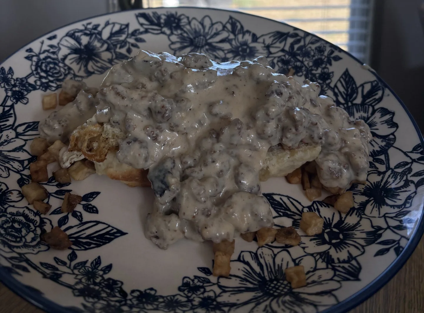 Southern biscuits and gravy with crispy potatoes