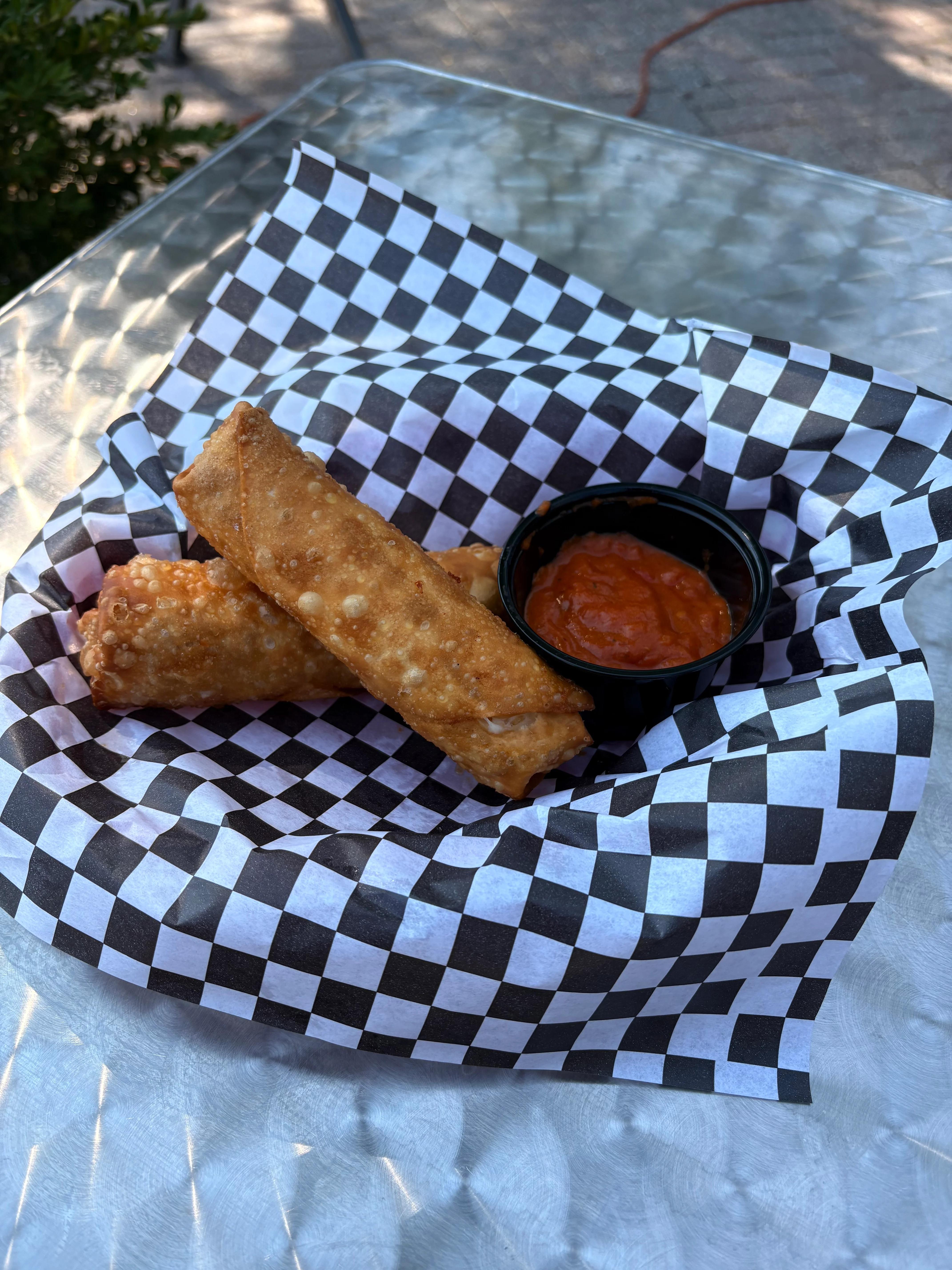 Crispy egg rolls served with dipping sauce