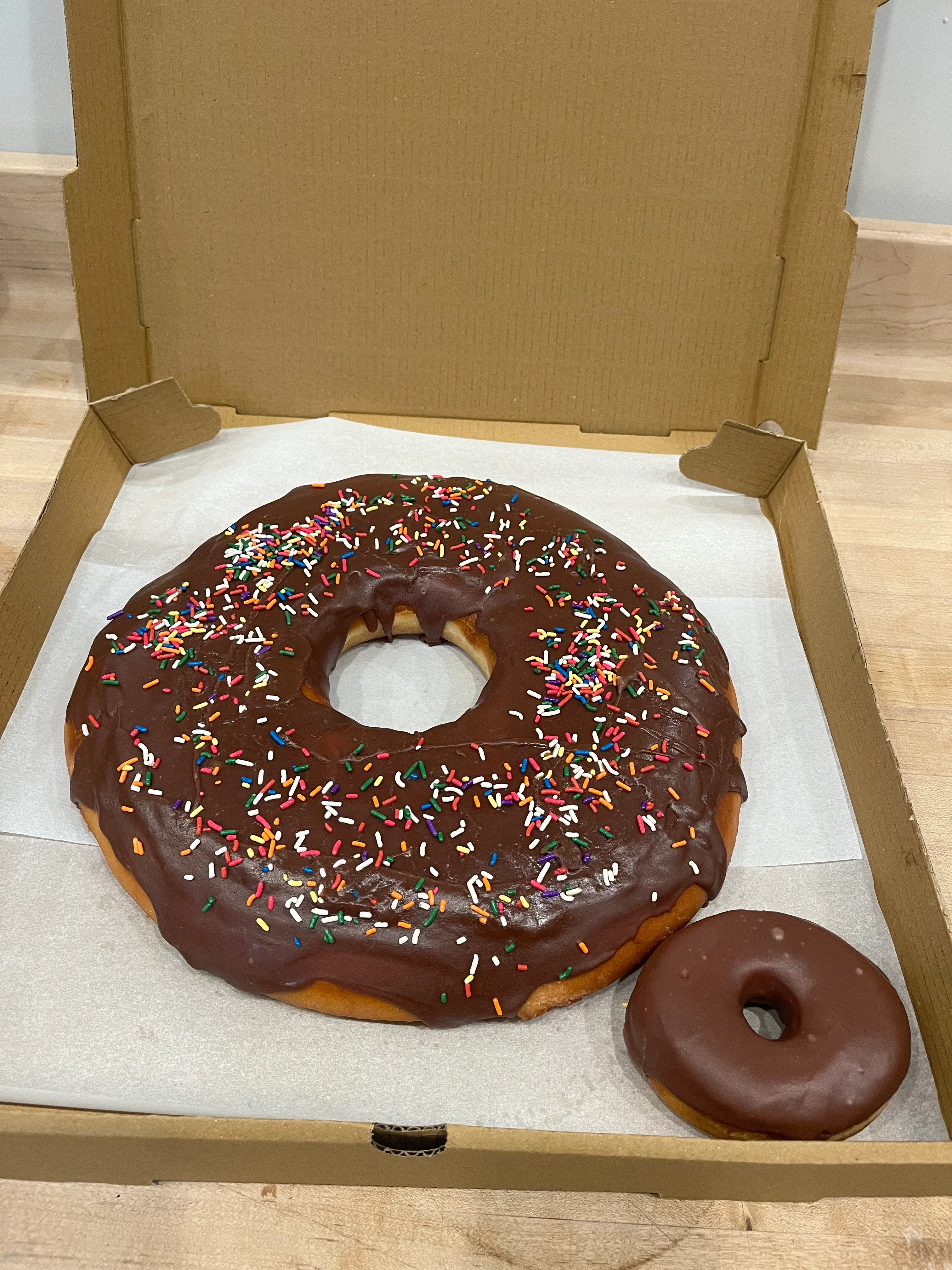 Giant chocolate frosted donut with sprinkles