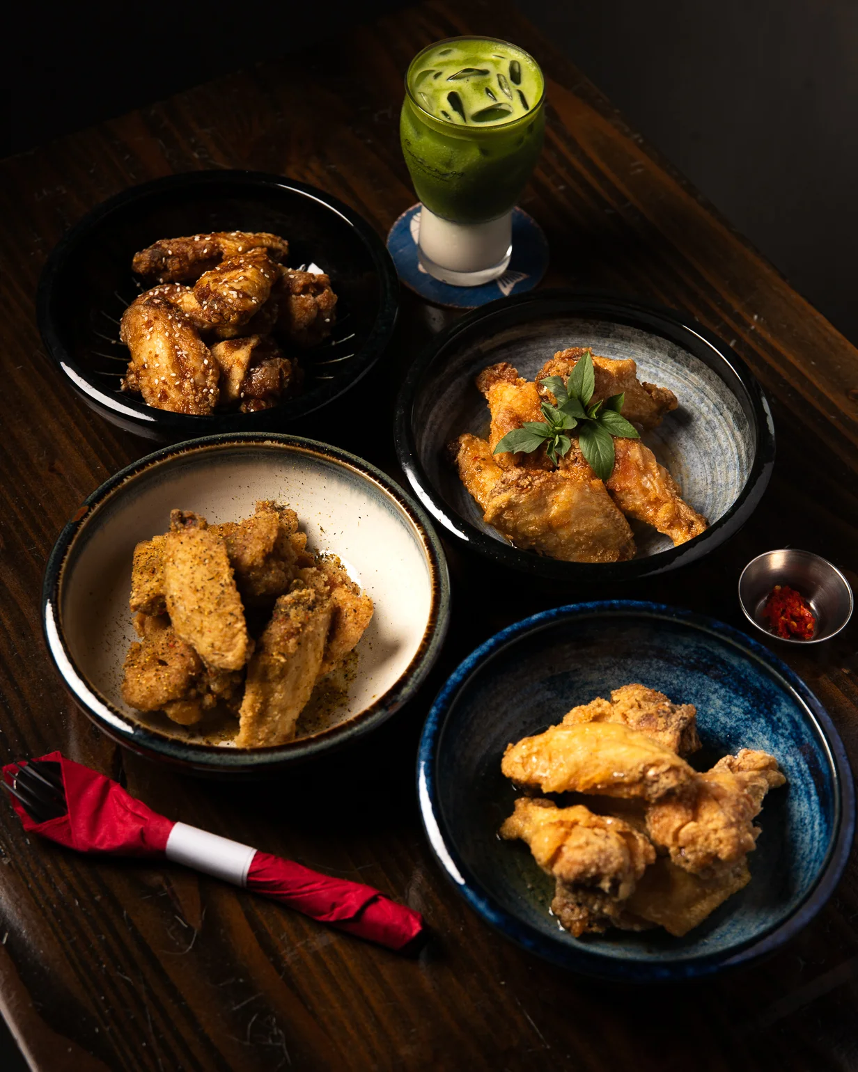 Assorted Korean fried chicken wings with a refreshing green drink