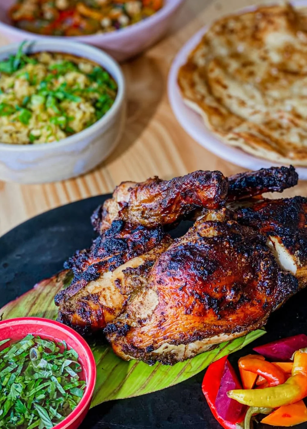 Grilled Jamaican jerk chicken with sides