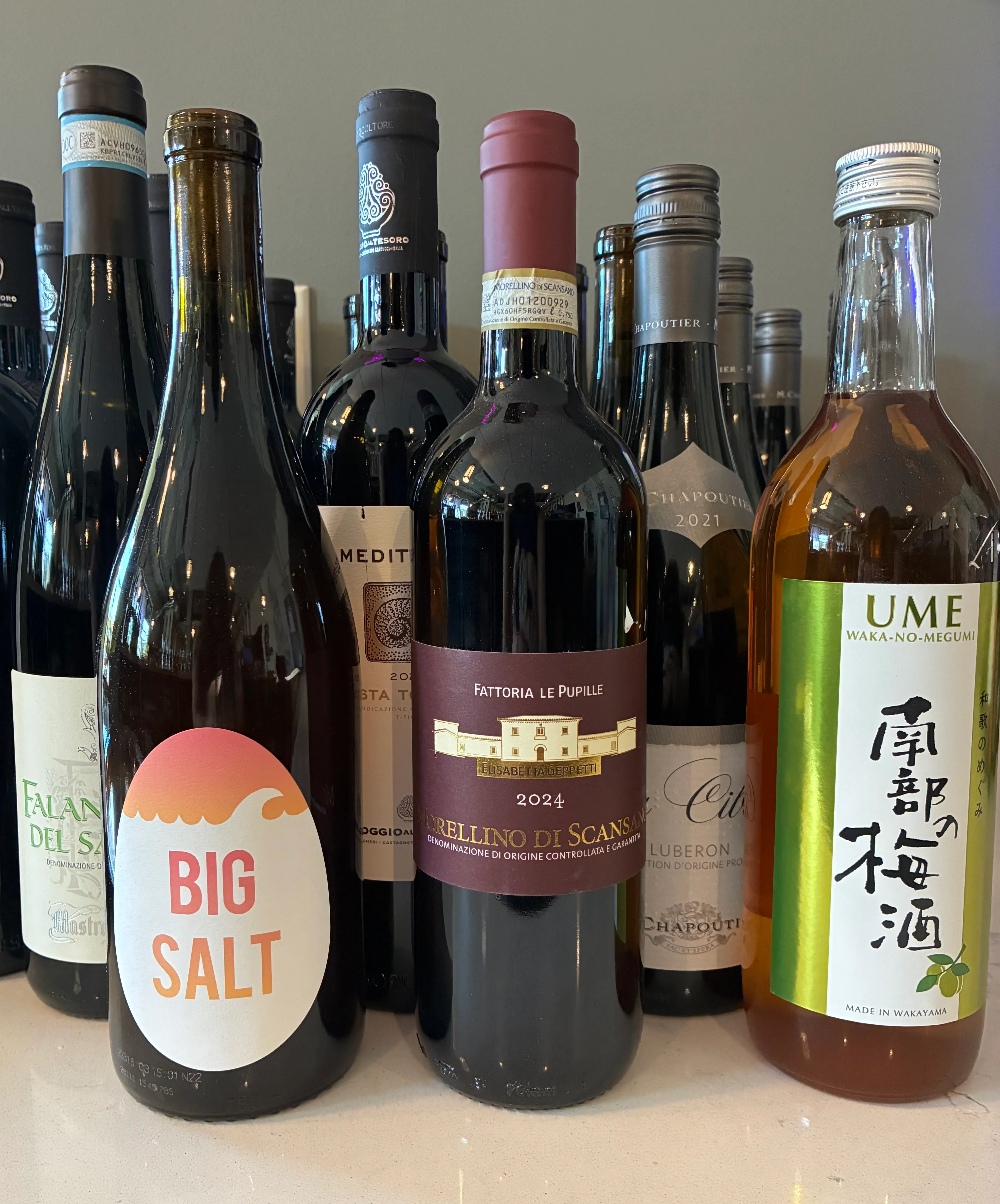 Close-up display of Italian wine bottles in a restaurant cellar