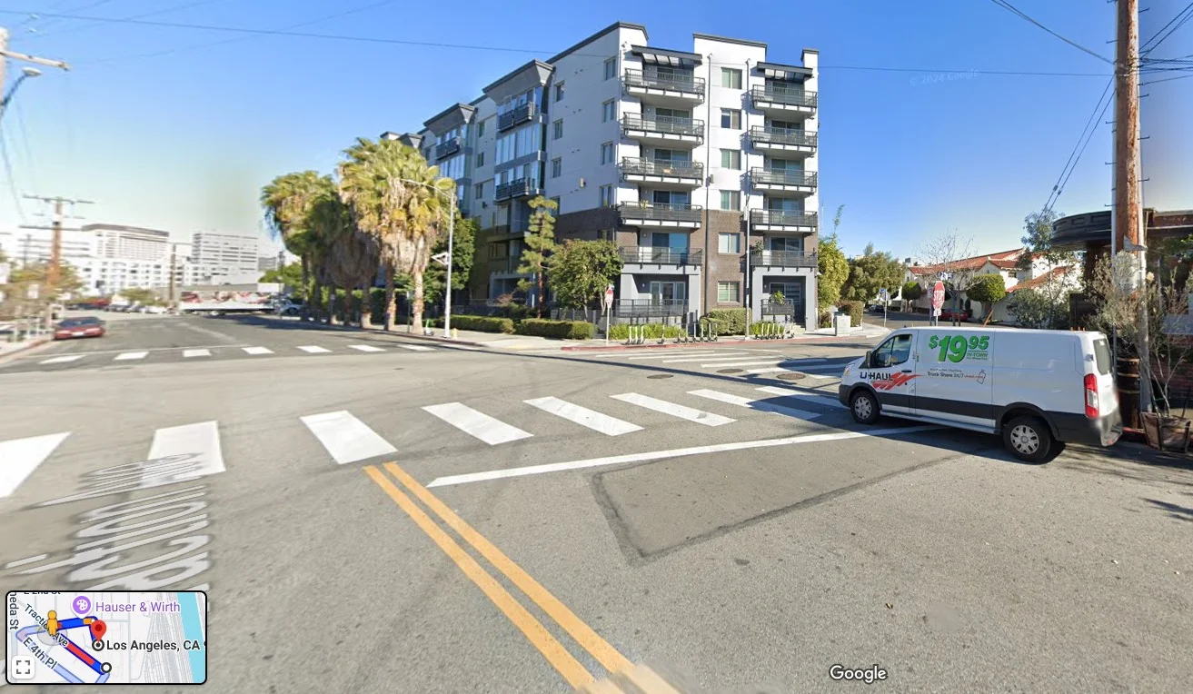 Modern apartment building in Los Angeles with palm trees